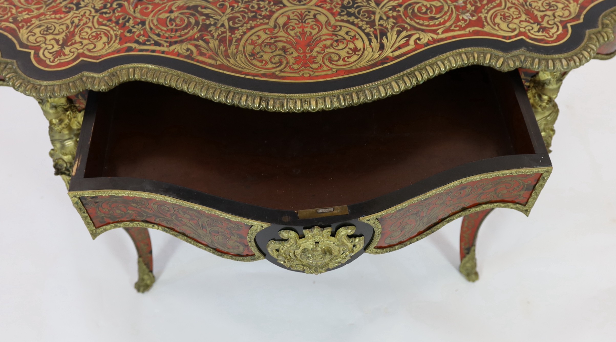A 19th century French red boulle bureau plat